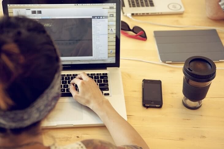 Person working on a laptop to represent the topic why are websites so expensive