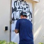 Rich painting the back door for his Ship It Day 2019 project