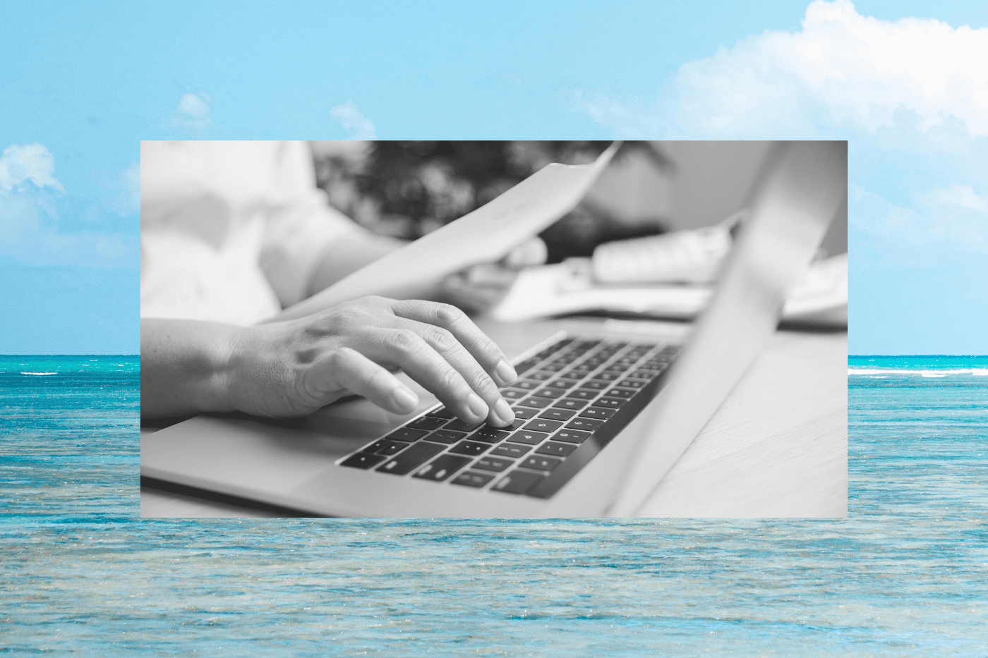 Black-and-white close-up of hands typing on a laptop while reviewing documents, representing nonprofit marketers analyzing donor retention rate data and improving donor retention strategies.