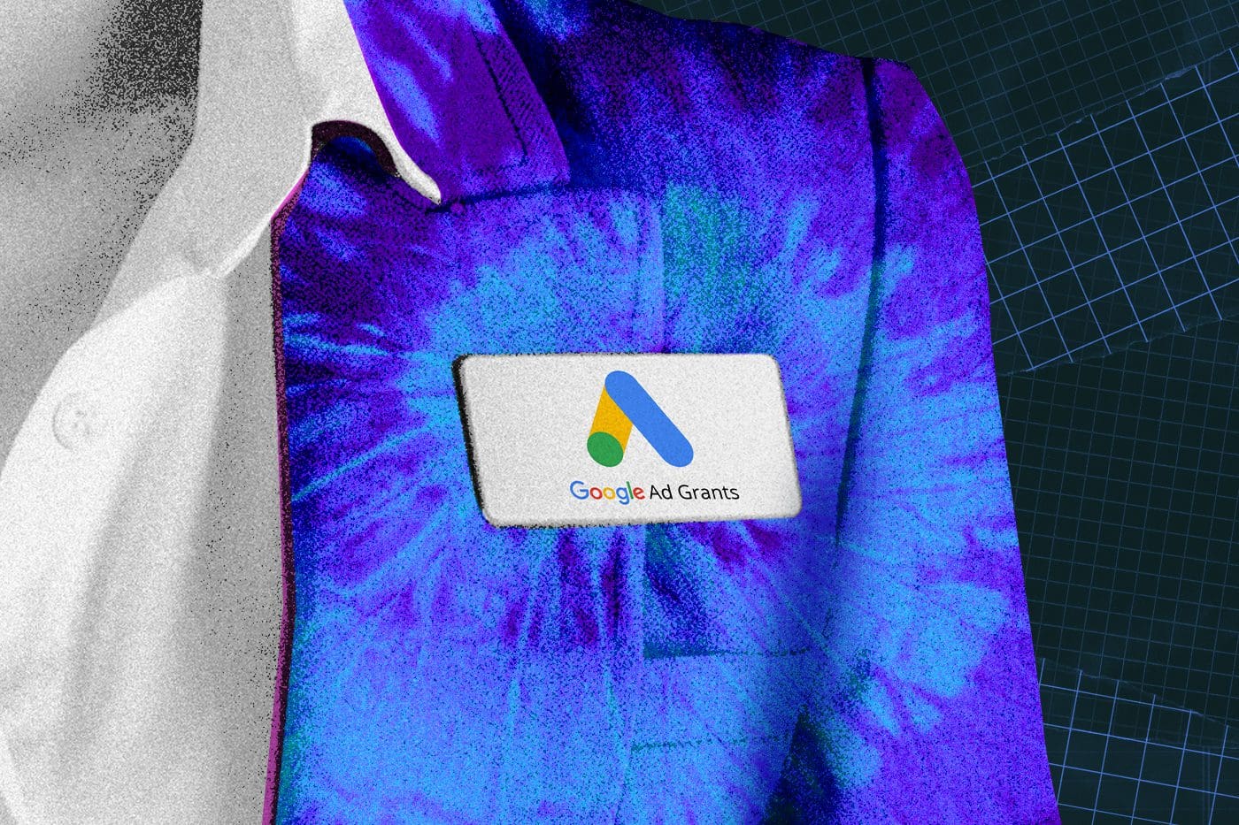 Close-up of a person wearing a suit jacket with a name badge displaying the Google Ad Grants logo, symbolizing support from Google Ad Grant agencies in digital marketing advocacy.