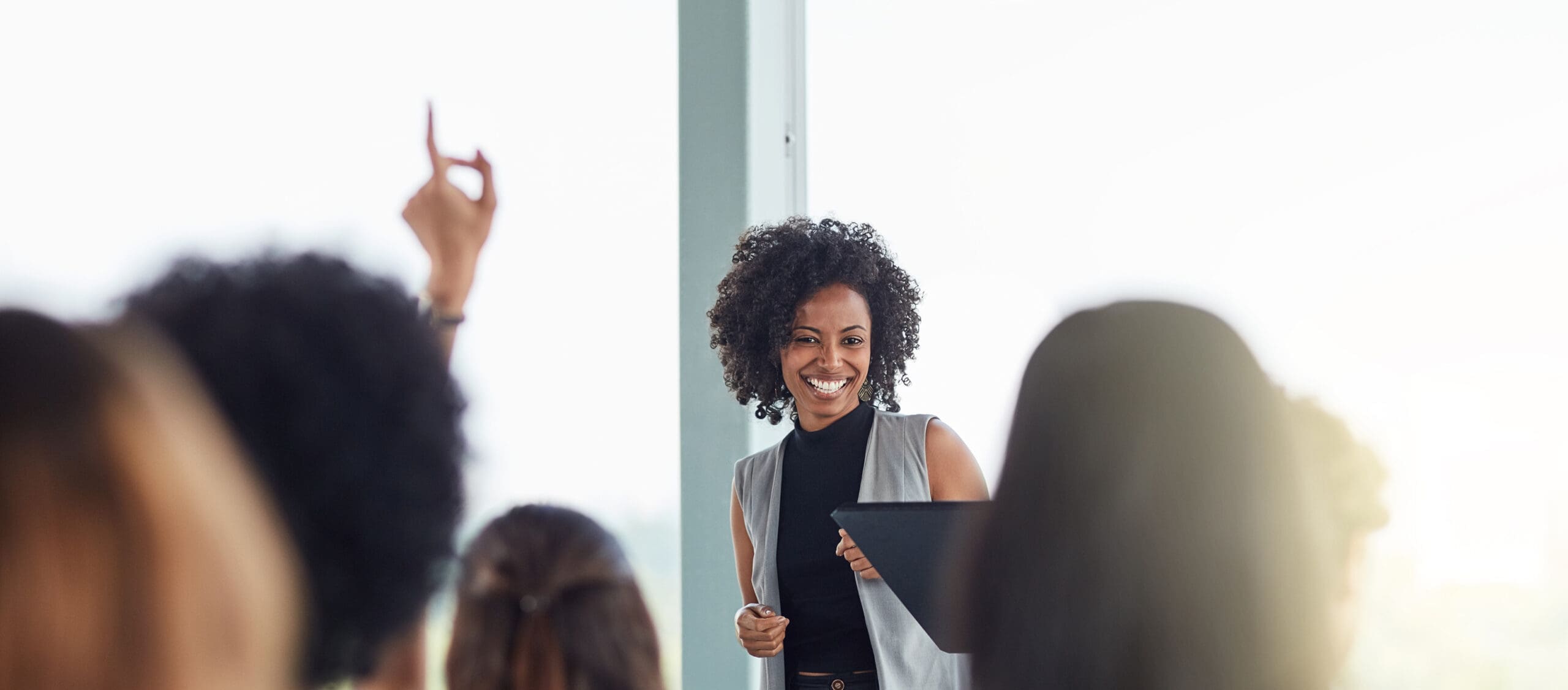 a Black woman leader hosts a meeting