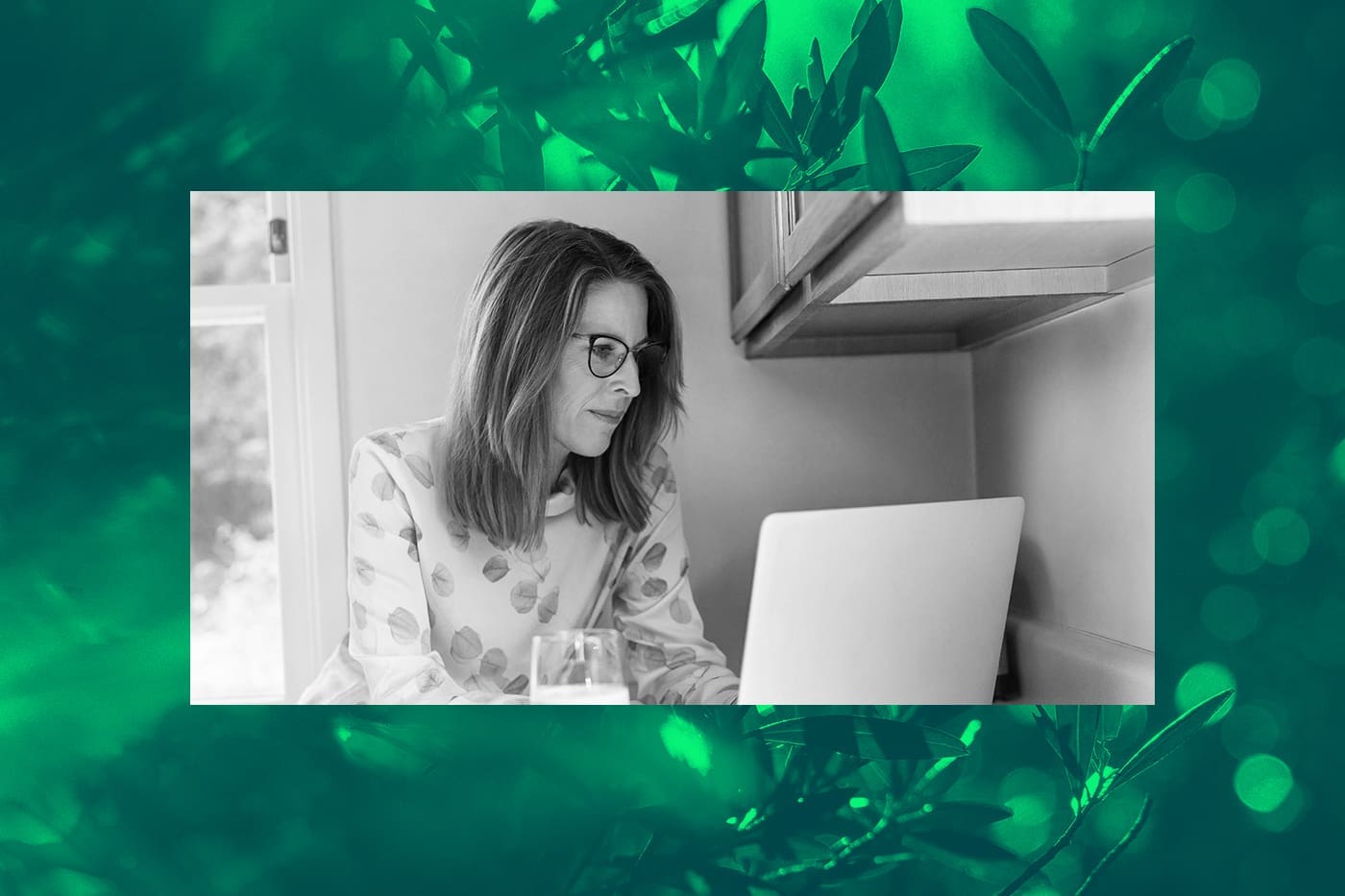 Woman working on a laptop at home, researching donor acquisition strategies to grow a nonprofit’s supporter base.