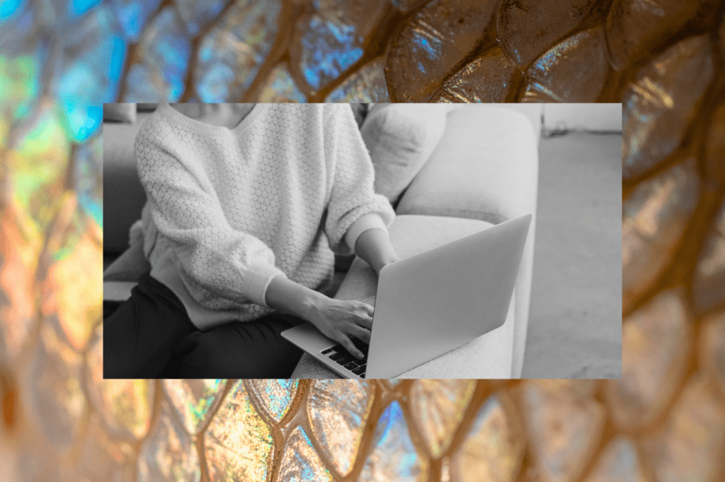 Black-and-white photo of a person relaxing on a couch while using a laptop, set against a colorful, abstract background—illustrating how museum websites compete with the comfort and convenience of staying home.