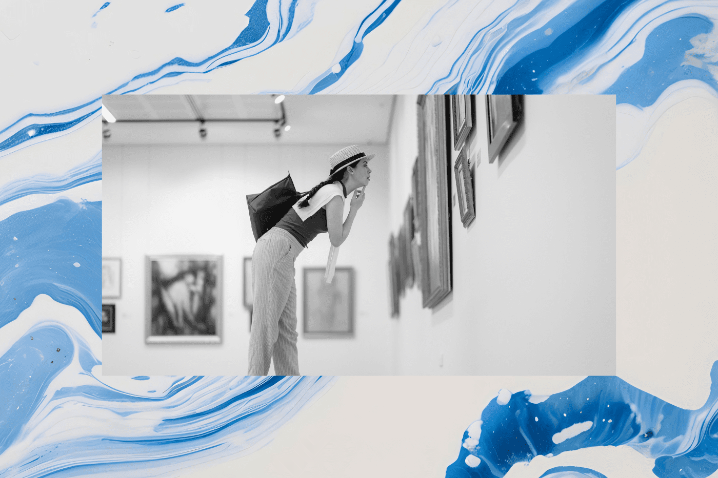 A woman in a straw hat and striped pants leans in to examine artwork on the walls of a museum gallery — illustrating the power of museum membership marketing to attract and retain visitors.