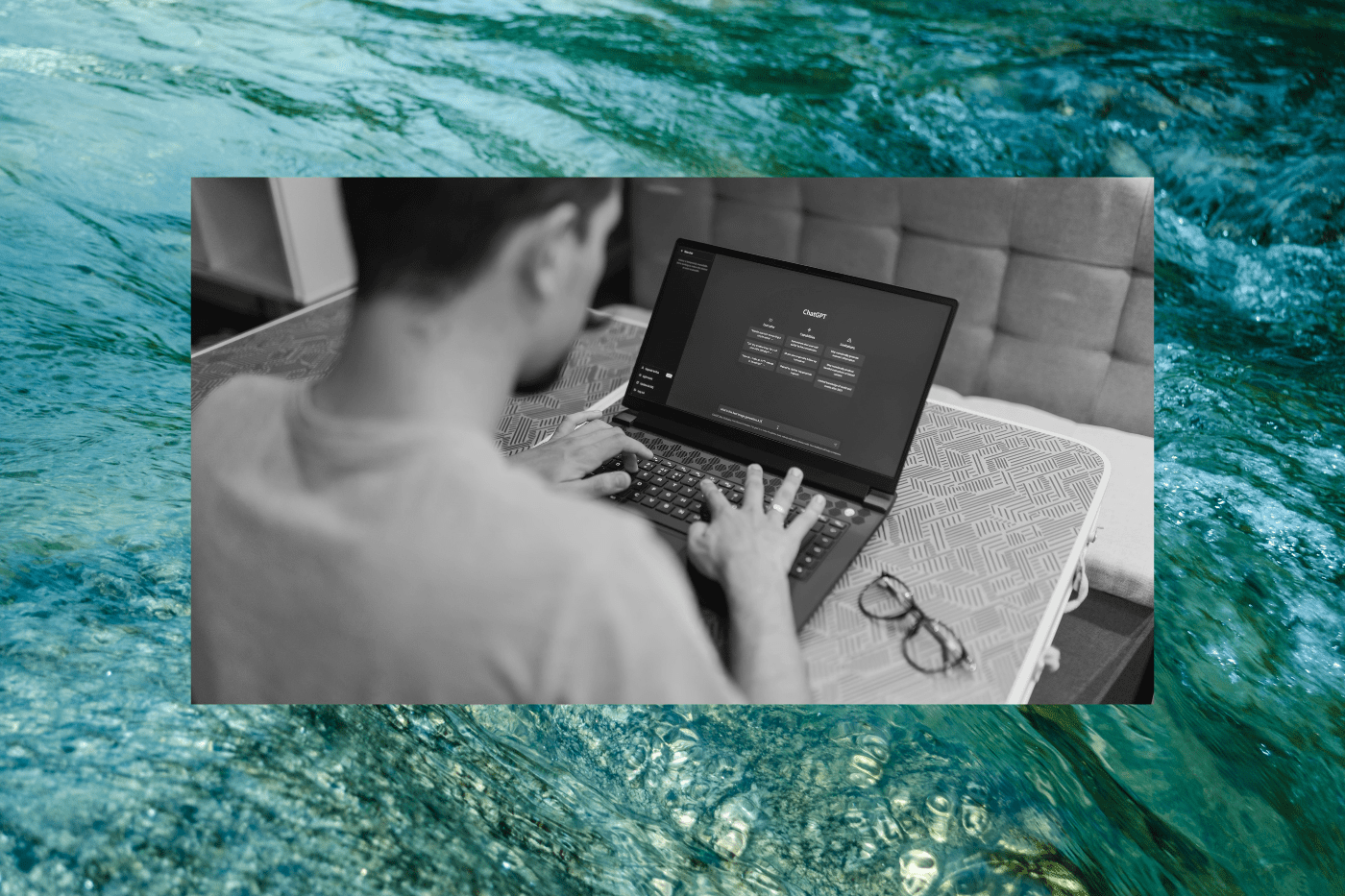 Person using a laptop with an AI chat interface open, overlaid on a flowing water background, illustrating AI search visibility, answer engine optimization (AEO), and HubSpot's AEO Grader tool analysis.